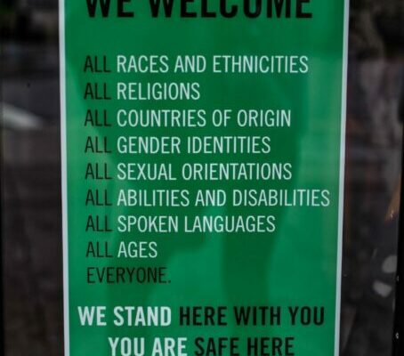 Green diversity inclusive poster titled We Welcome