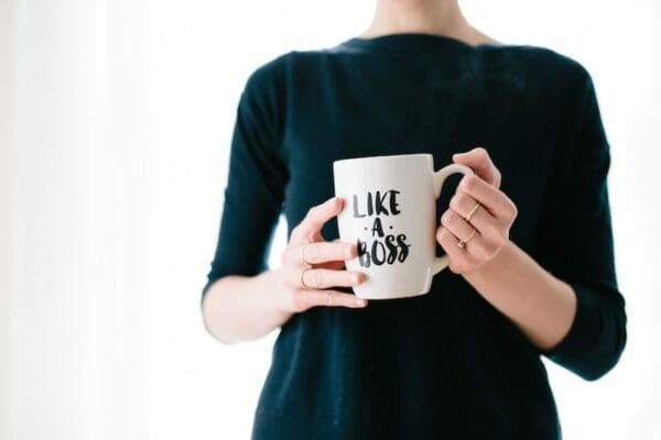 Businesswoman holding a mug that says Like a Boos