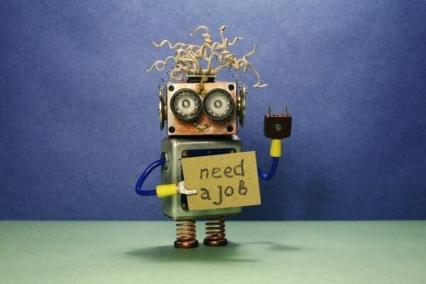 Cartoon robot holding a I need a job sign for job hunting