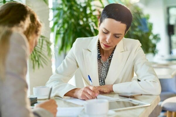 Assertive Female Business Leader Signing Papers