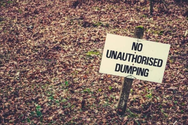 No Unauthorised Dumping Sign in the grass