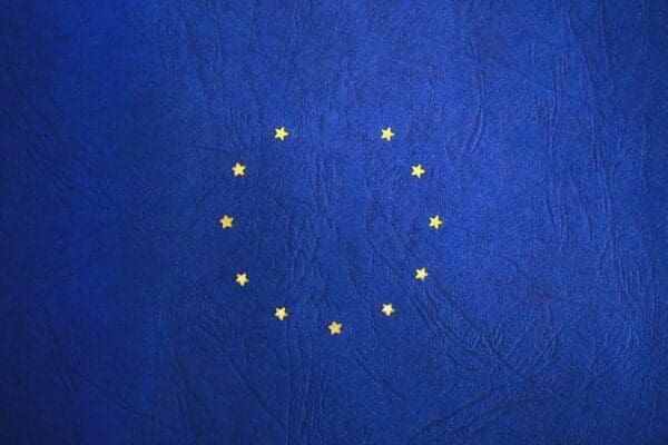 Gold stars in circle on blue background representing the European Union flag