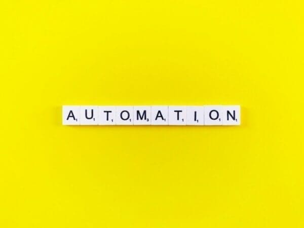 The word Automation on word scramble blocks with a yellow background 