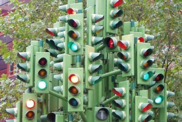 Many traffic lights bunched together creates confusion