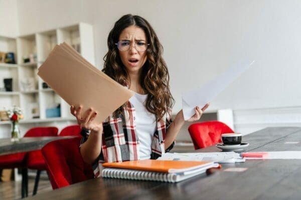 Businesswoman with questionable look at training course material