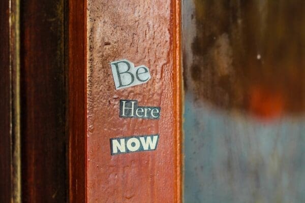 Be here now stickers on a door post for What Mindfulness Can Bring To Marketing