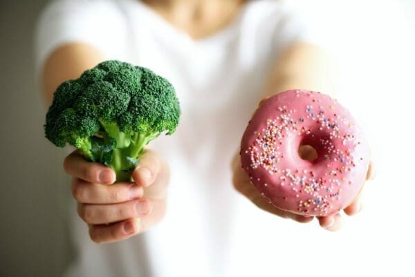 Choosing between healthy food choice broccoli or junk food donut for HFSS legislation