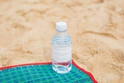 Bottled water on a beach towel