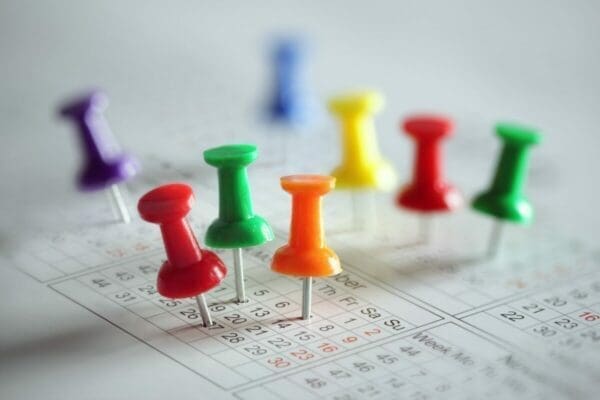 Coloured pins in a calendar for account manager calendar appointments