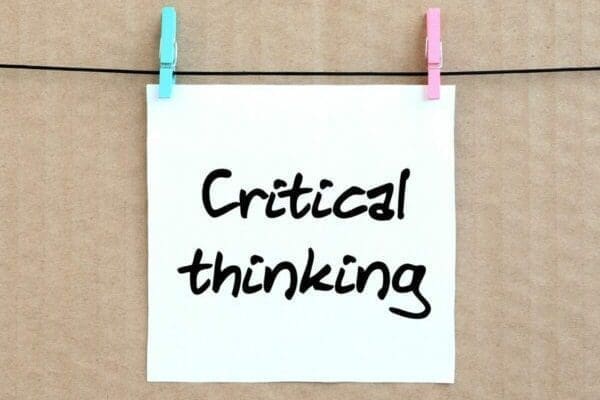 Critical thinking on a note pinned to a line