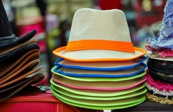 Pile of colorful hats on stand