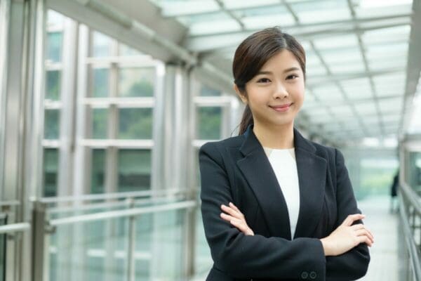 Professional business woman with arms folded