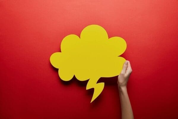 Yellow thought bubble on red background