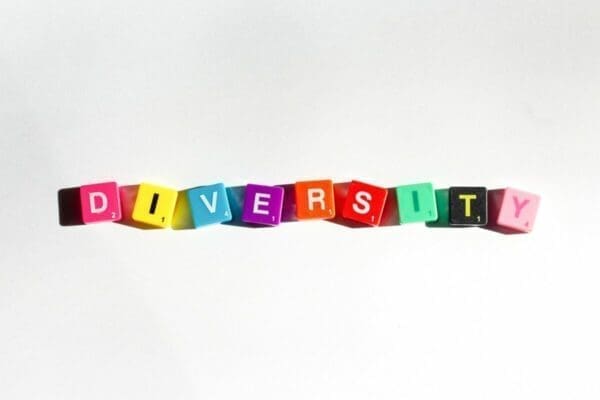 Diversity spelled with colourful word cubes on white background