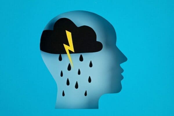 Cartoon head with a raincloud inside represents bad mental health