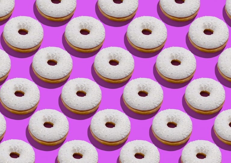 Many rows of white donuts