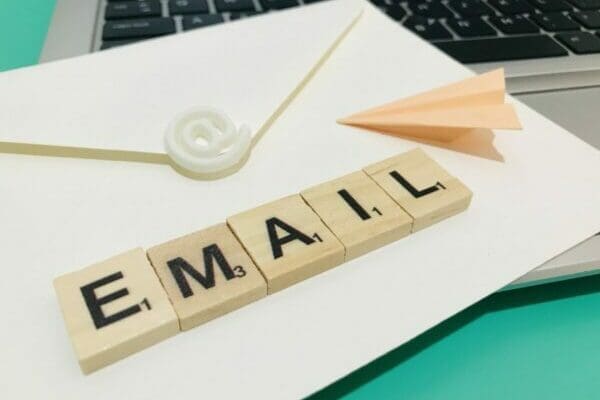 Email spelt in scrabble tiles on white envelope
