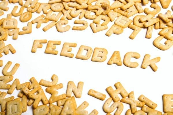 The word Feedback spelled out in biscuits