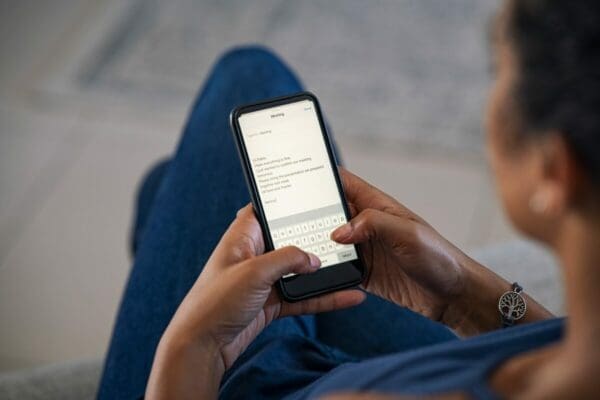 Woman replying to an email using a smart phone