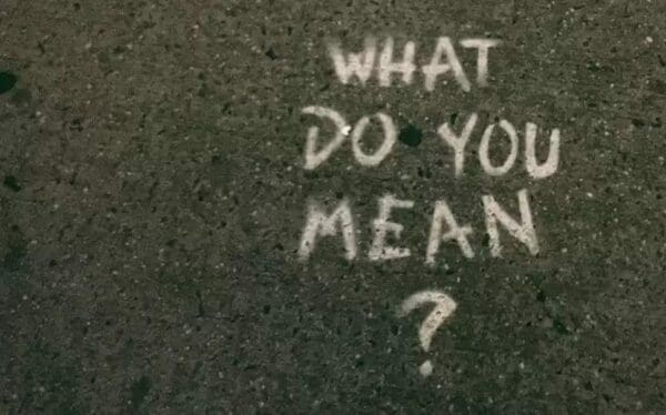 What do you mean? written with chalk on the ground