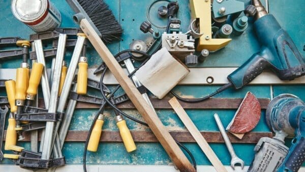 Many tools laid out on a blue surface