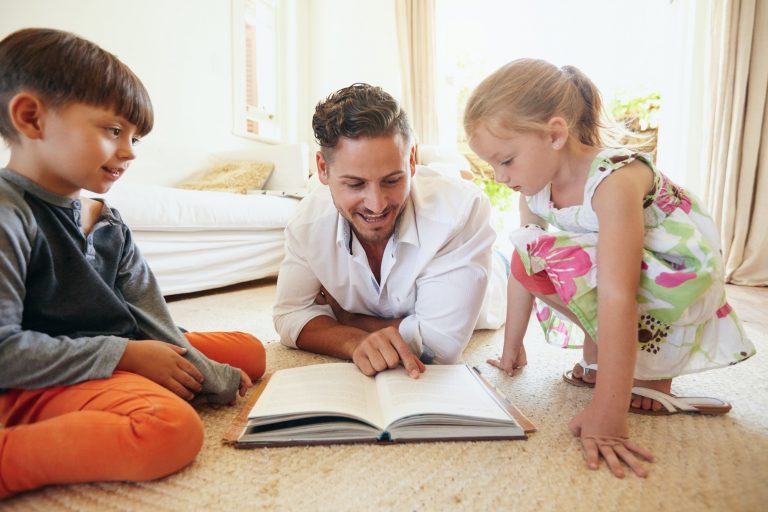 Father reading stories to his children