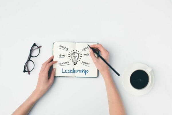 Notepad with leadership written and lightbulb drawing