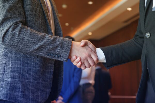 Businessmen shake hands after a negotiation