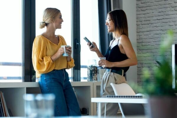 Two female business startups engaging in small talk to build their business