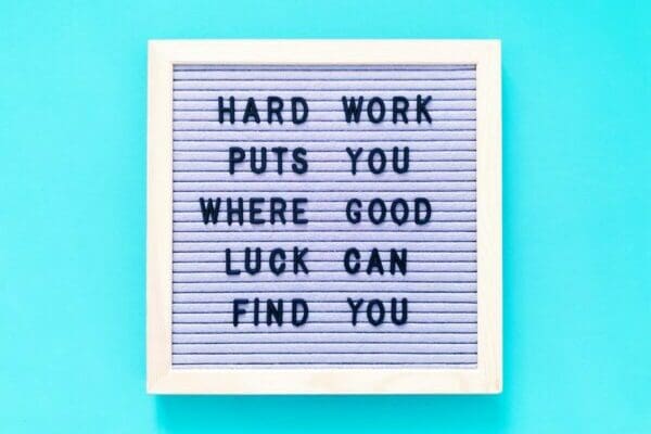 Hard work puts you where good luck can find you Quote on light blue background