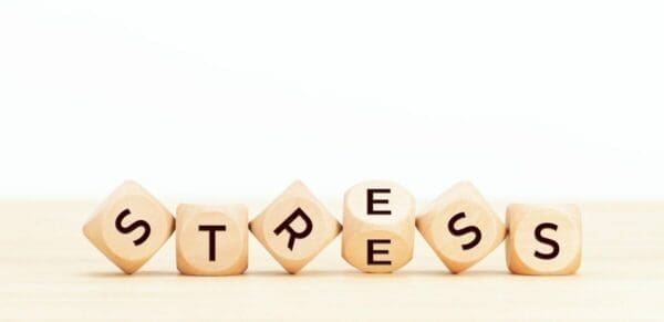 Stress spelled with white cubes