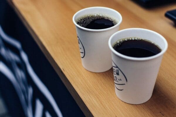 Two brewed coffee in cups