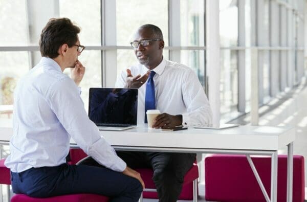 Two businessmen talk to resolve a conflict