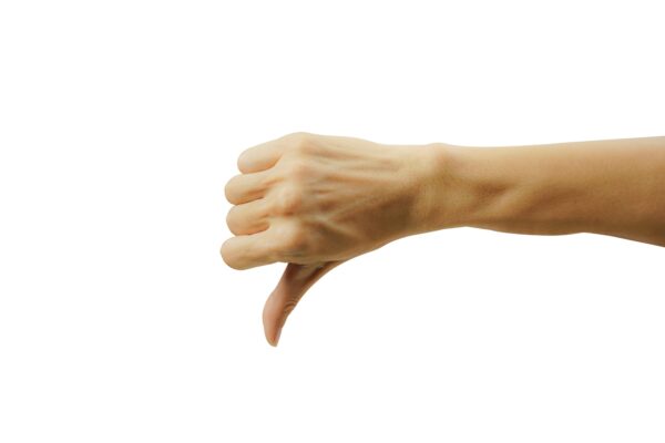 A man hand with thumb down isolated on white background