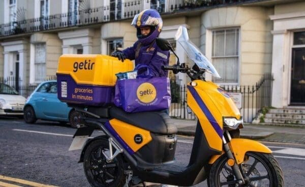 Getir delivery driver unloading delivery from motorbike