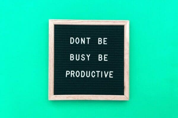 Don't be busy be Productivity quote on blue background