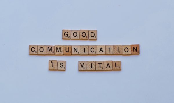 Good communication is vital spelled out in wooden tiles