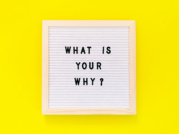 What is your why? quote written on felt board