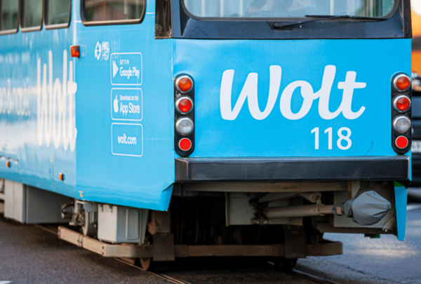 Back of a tram with advertising of the brand Wolt