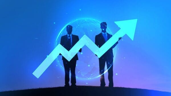 Silhouette of two businessmen holding a blue arrow representing keeping up with the trend