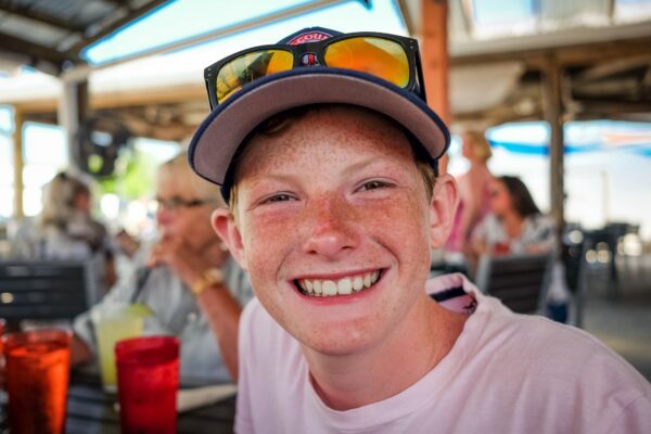 Young boy with many freckles on holiday