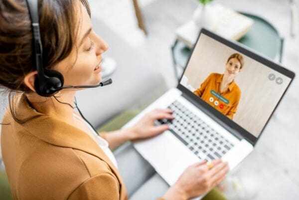 Female remote worker having a video call with a coworker