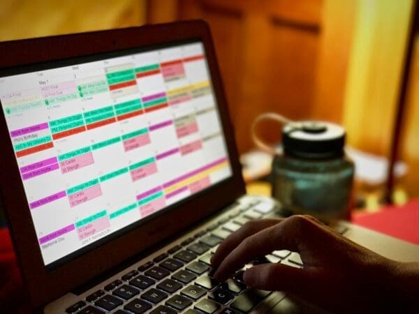 Laptop showing colourful calendar management