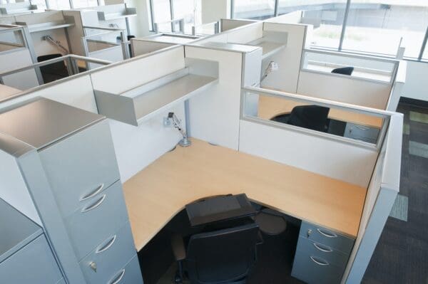Empty cubicles in grey and lifeless office