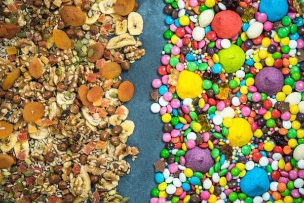 Junk food and sweets separated from dried healthy snacks