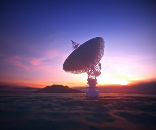 Satellite radar against a sunset background