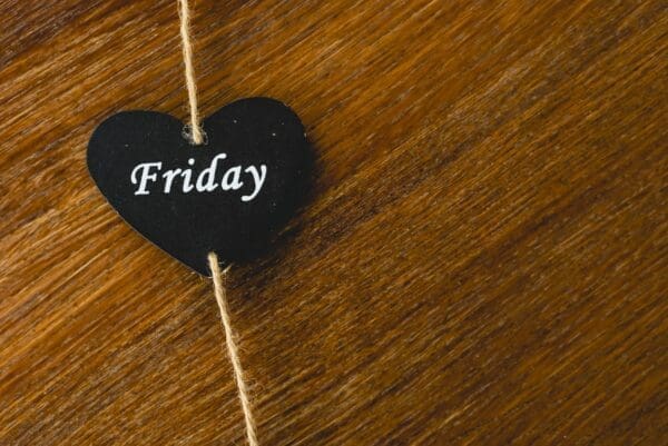 Friday on a black heart-shaped tag