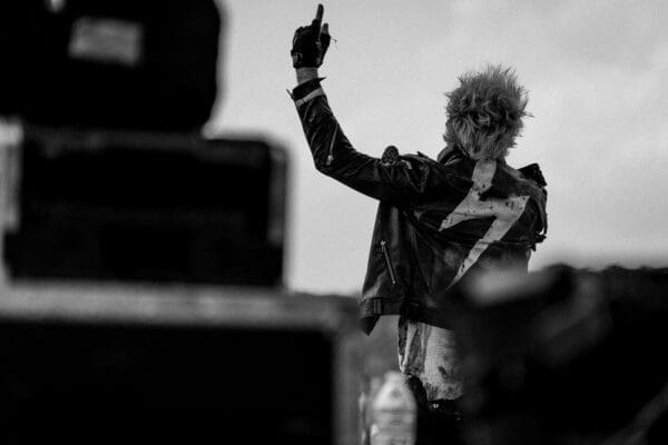 Black and white photo of a rockstar on stage 