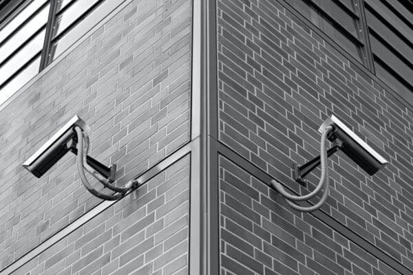 Symmetric Security Cameras on the wall of a grocery store