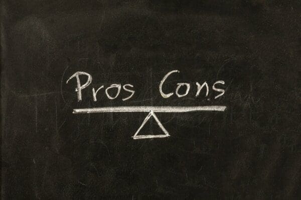 Pros and cons written on a chalkboard